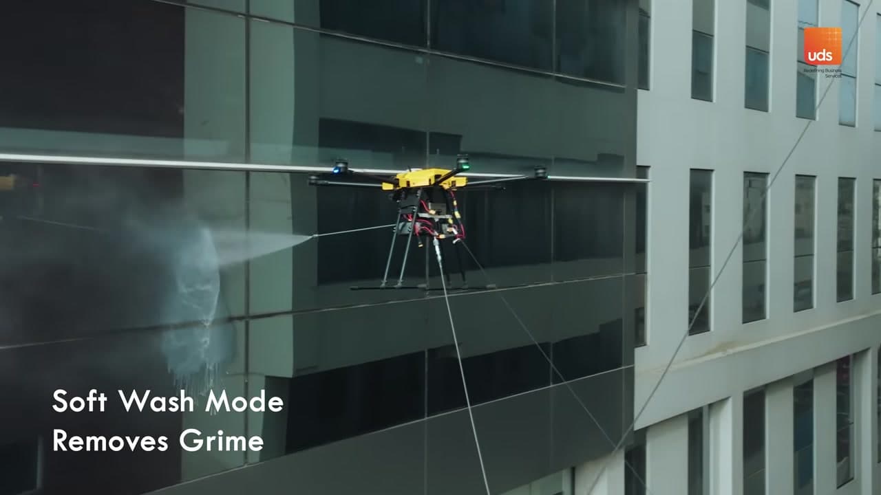 Drone cleaning a building facade